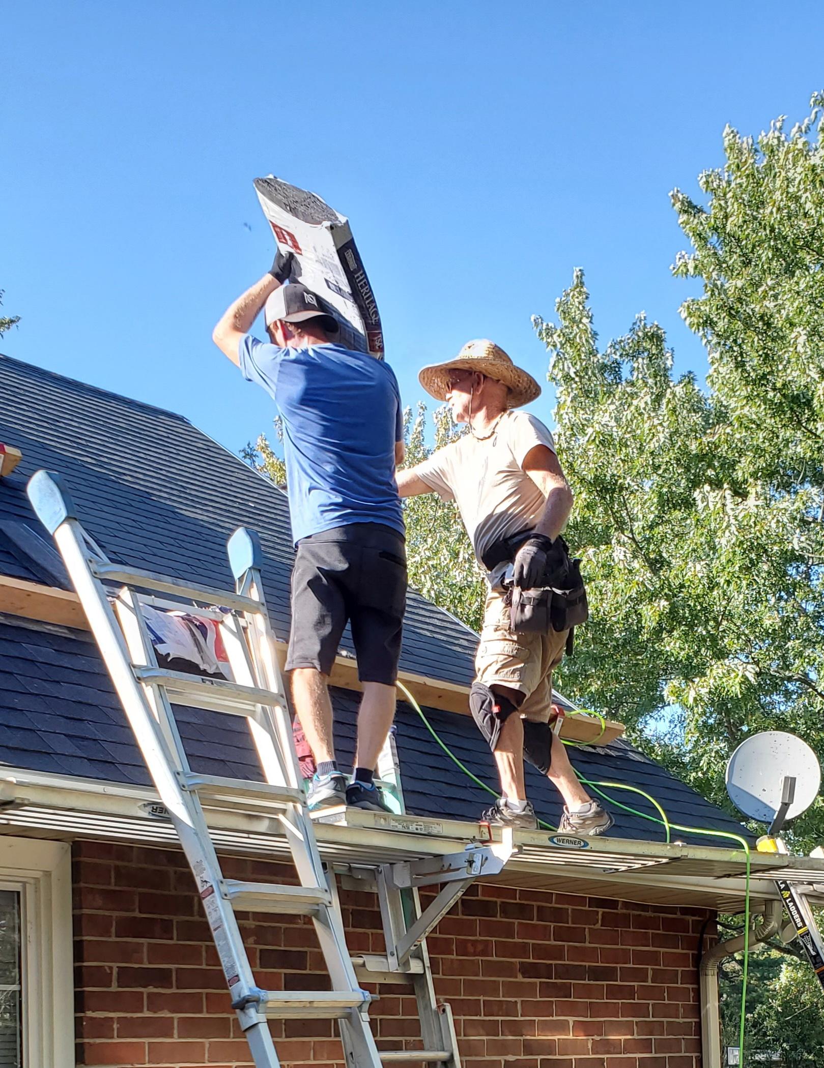 TJ and Dad roofing TJ's house